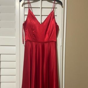 Red prom dress with slit and pockets